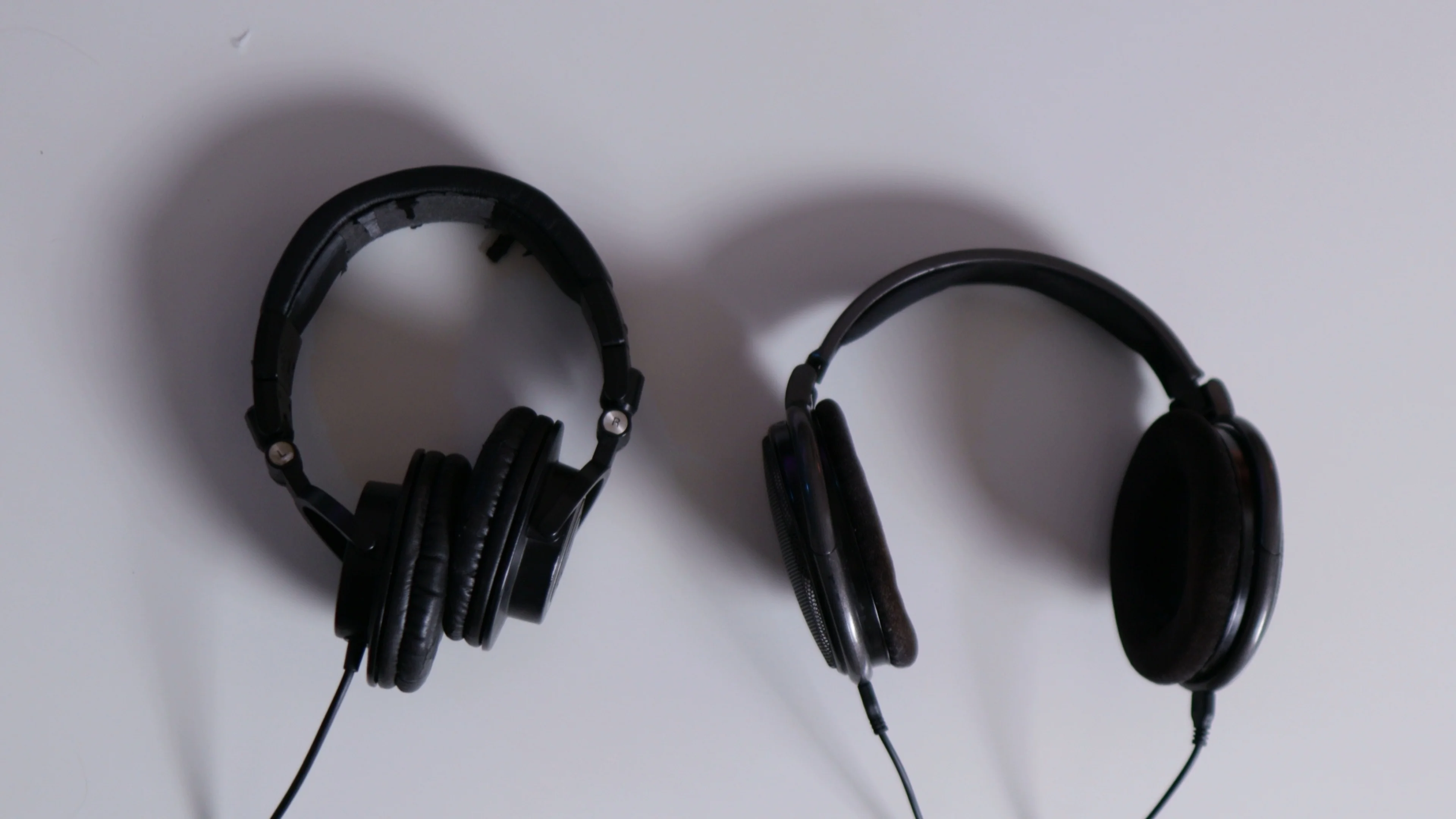 Closed-back and open-back studio headphones for precise monitoring during vocal compression and mixing