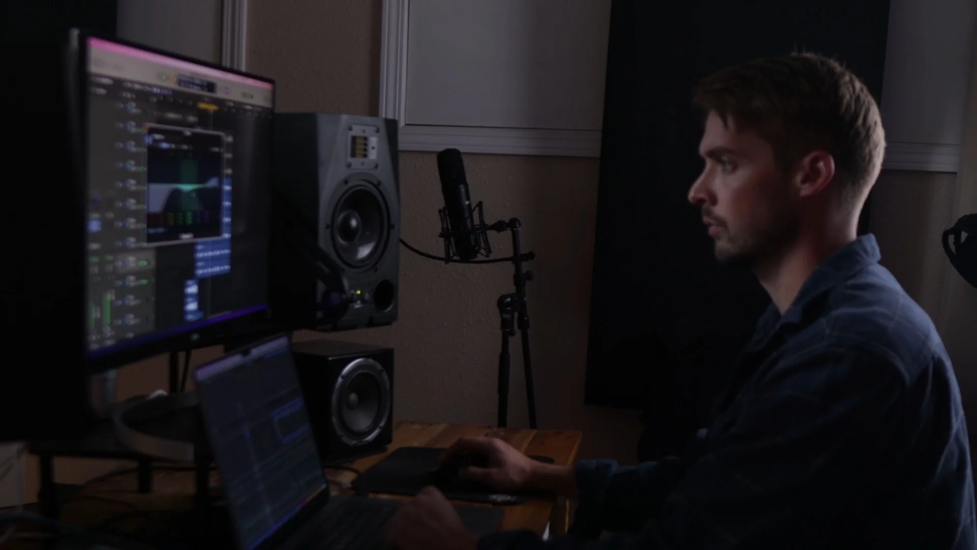 Mattie working on a Logic Pro mixing session in home studio, showcasing the interface where AI session players integrate with traditional music production workflow