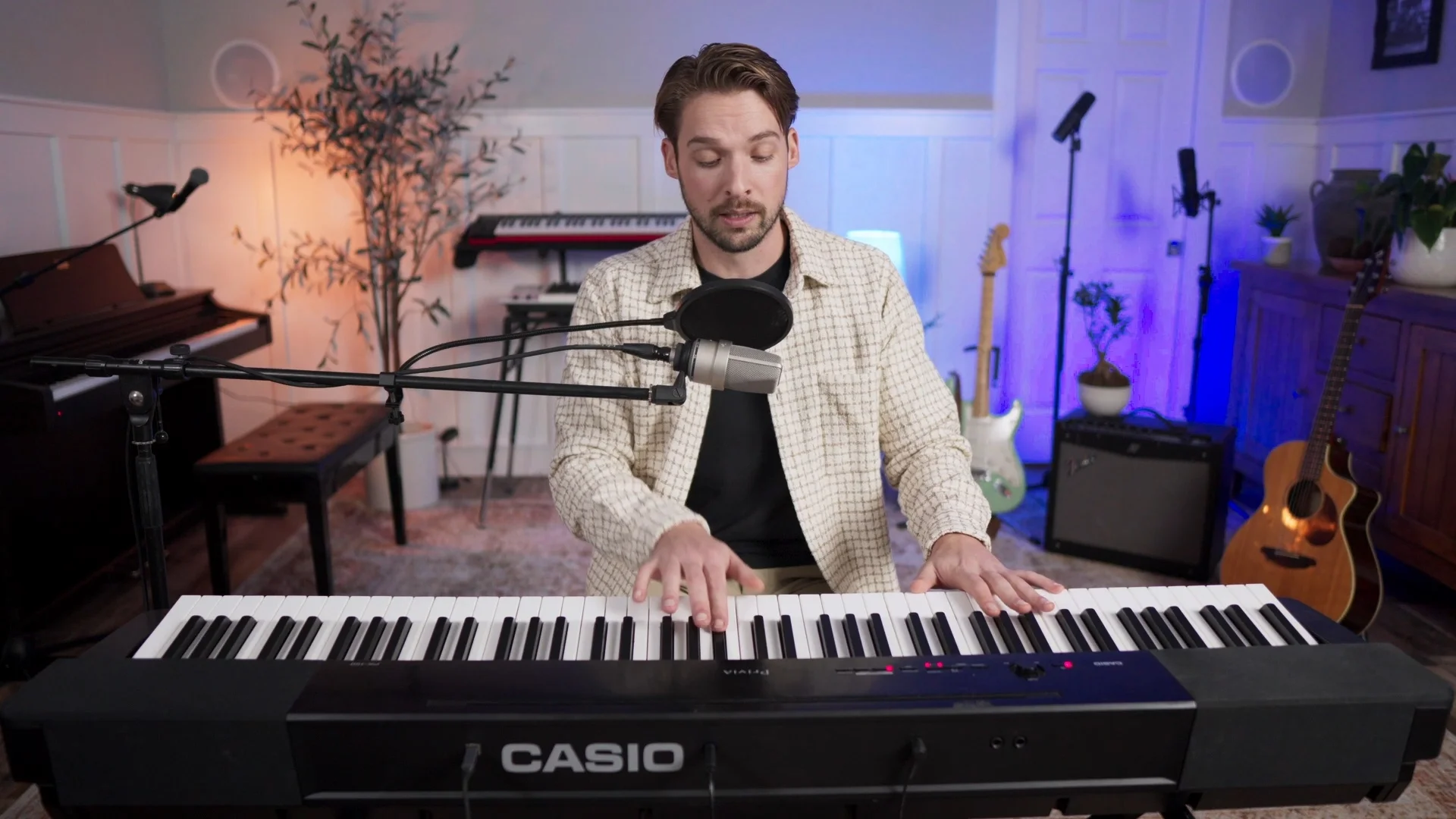 Mattie playing piano keys during melody composition, demonstrating how to identify musical keys by ear