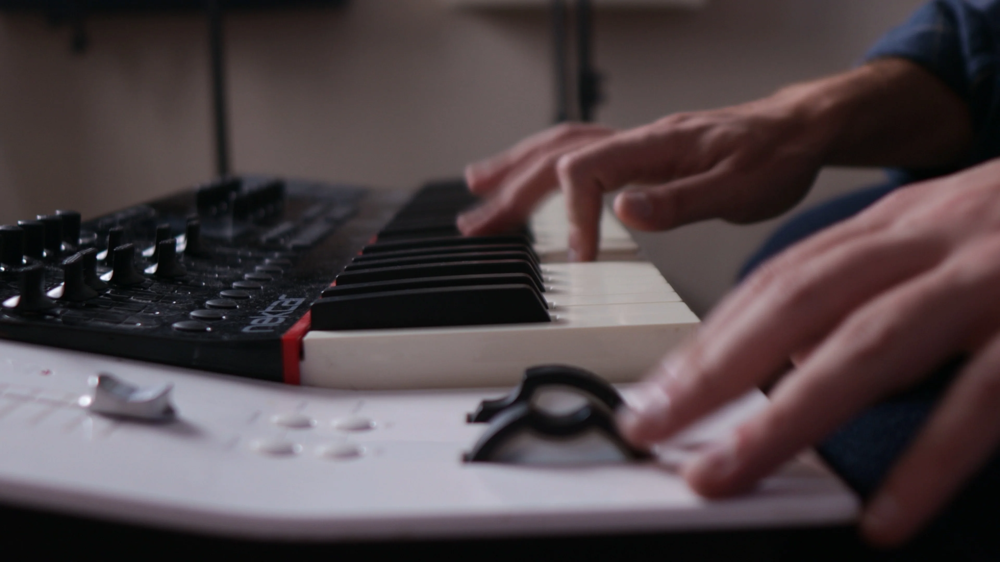 Mattie playing MIDI keyboard while working on songwriting and lyric composition